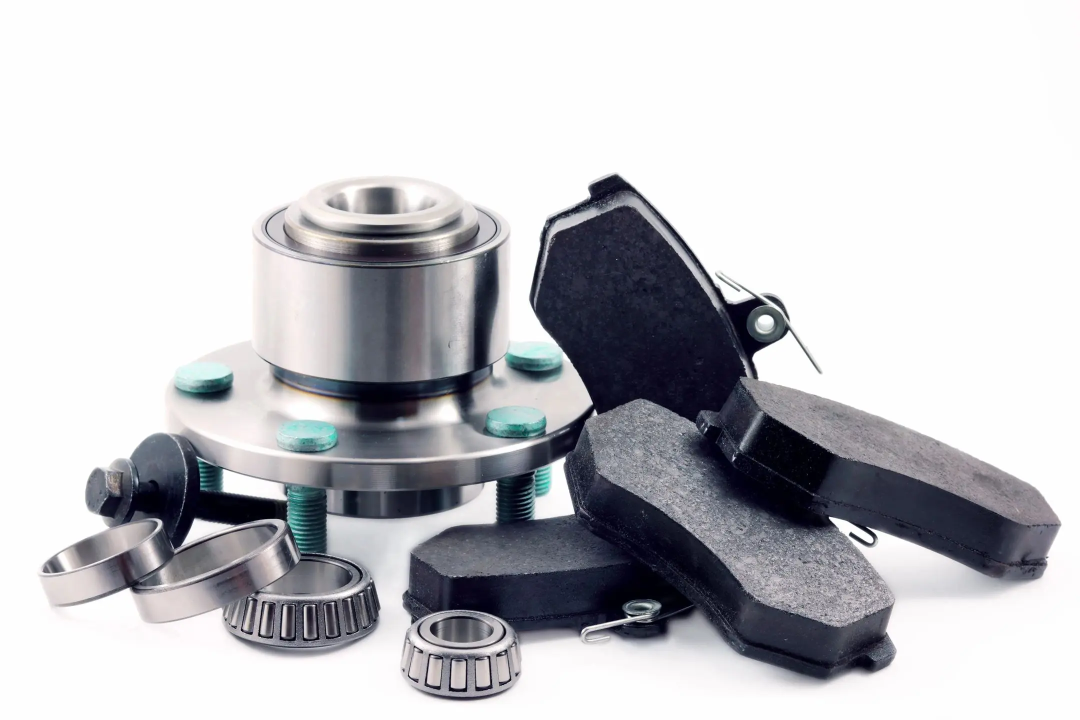 fm=f_10553 A pair of brake pads and a wheel bearing.