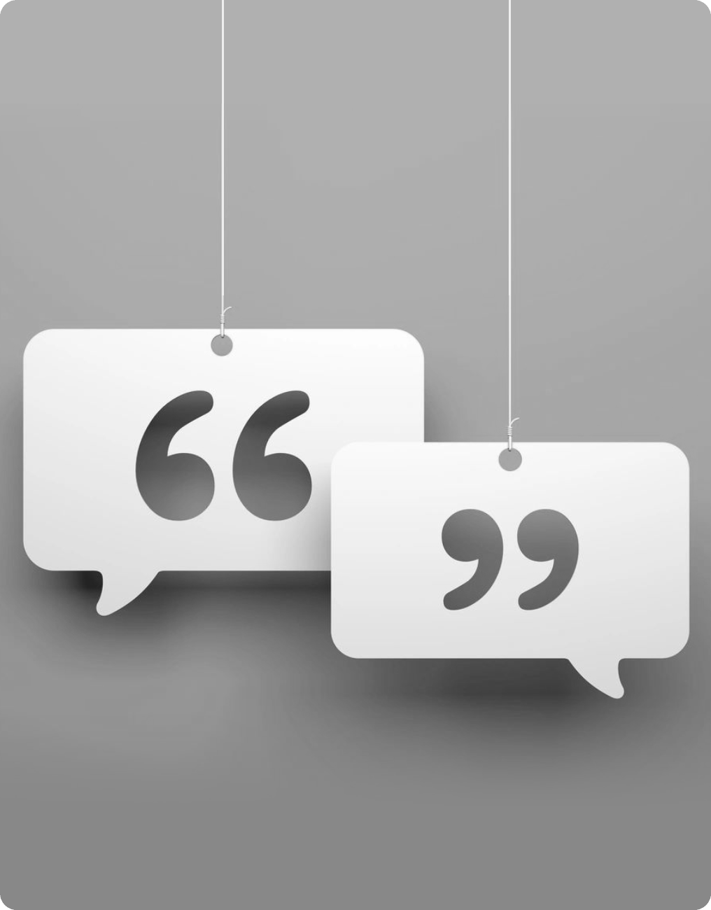 Two white speech bubbles with a string hanging from them.